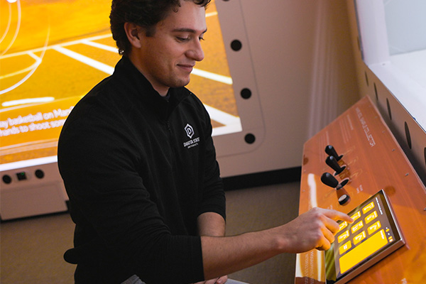 DSU student Jayden Kruse demonstrates a hands-on activity he helped develop for Mission Infinity. 
